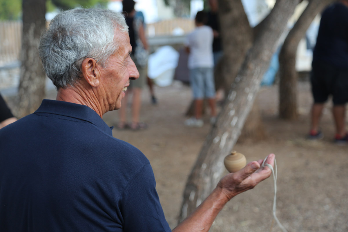 “Spinning Tops’ Championship” for adults, an event of the 10th festival Routes in Marpissa. Marpissa, 2019
