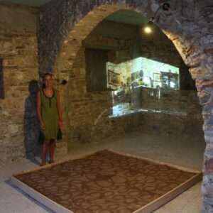 Inspired by the description of the way the earthen floor used to be decorated, artist Ada Anastasea created the work “Patosi” (meaning flooring), which was presented at the “Routes in Marpissa” festival in 2013.